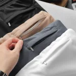 Quần Short Thun Nam Phối Sọc Màu Túi Kéo