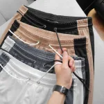 Quần Short Thun Nam Phối Sọc Màu Túi Kéo