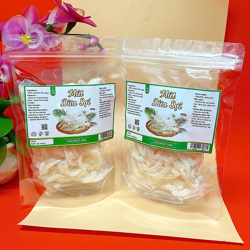 23383_z6129056901082-6e534c78cc3ff3cff29fc2906fefea3f_20241214124302-1.jpg Mứt Dừa Sợi Túi Zip 300g - MDNMHCK