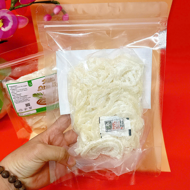 23383_z6129056907229-749fbd1f94aa384efbc90341dfb77e22_20241214124301-1.jpg Mứt Dừa Sợi Túi Zip 300g - MDNMHCK