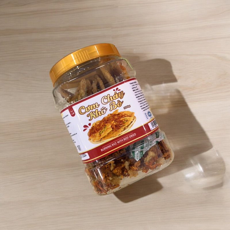 24703_z5642162346461-16090b4f7ba5ad6172c72dc3ff483156-photoroom_20240718110423-4.png Cơm Cháy Khô Bò 500g hộp - 8936208933326
